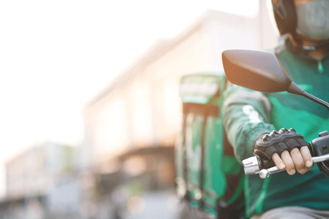 Delivery rider on a motorbike