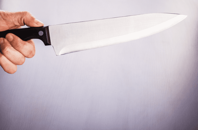 Hand holding a kitchen knife