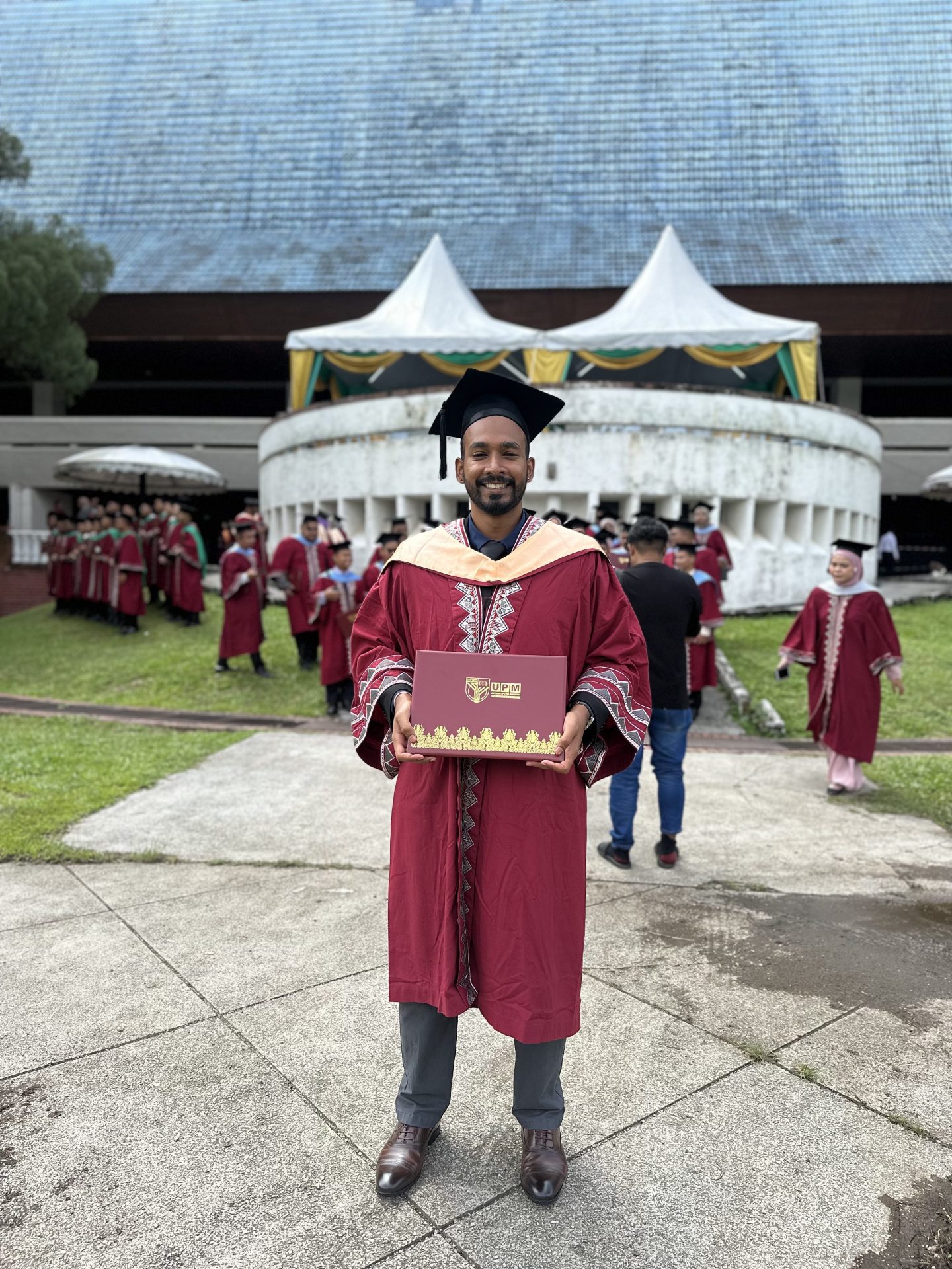 Seelan graduating with Master's degree