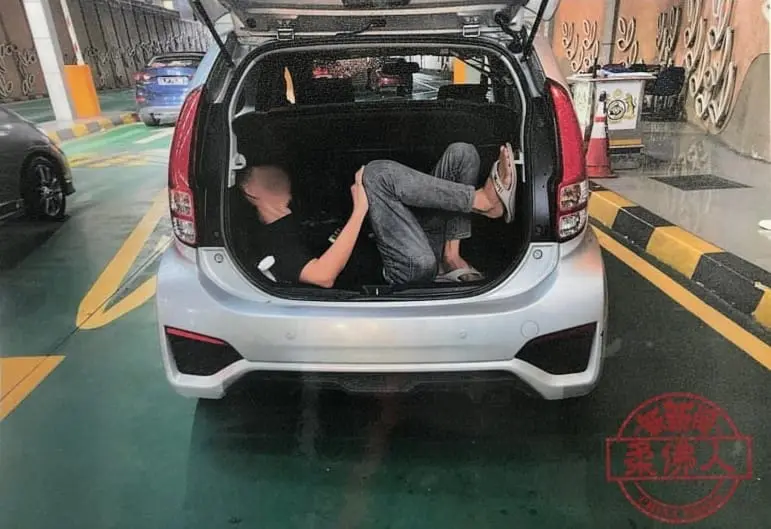 SG man caught hiding inside Myvi car boot