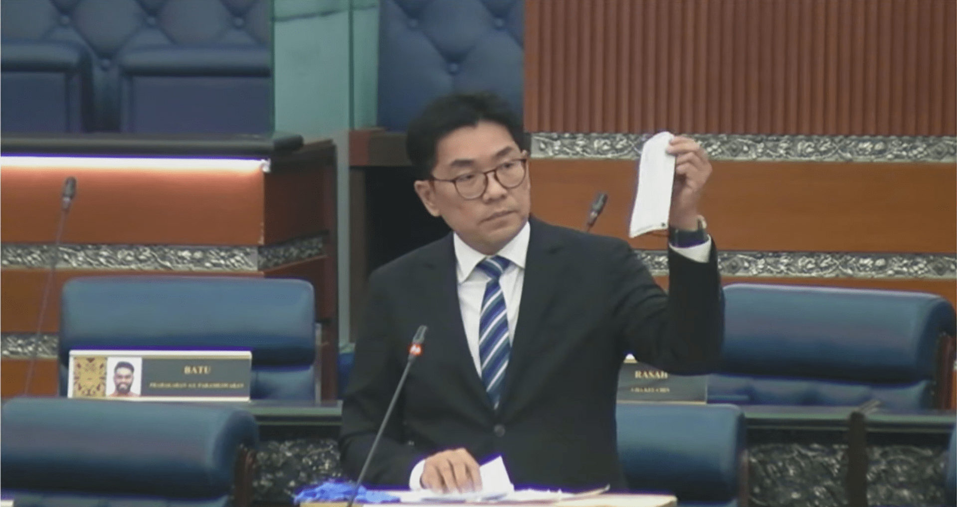 Sim Tze Tzin showing a face mask