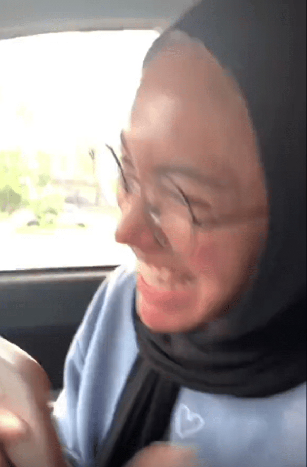 Sister smiling after getting new car