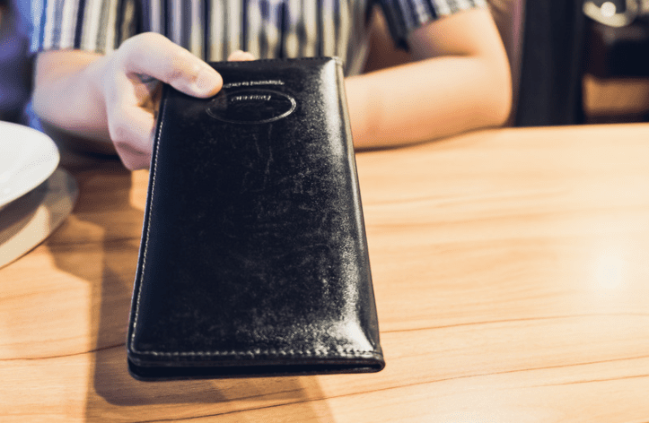 Staff handing the restaurant bill
