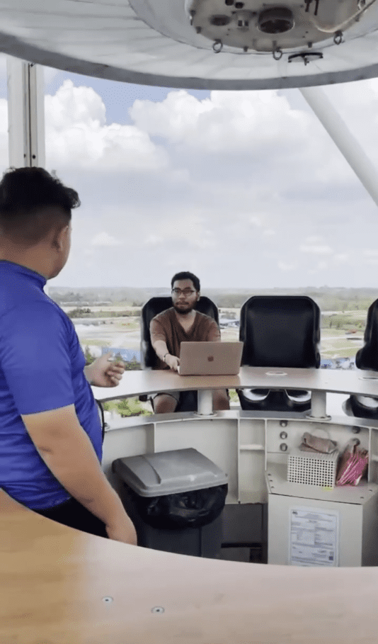 Staff member talking to Jann