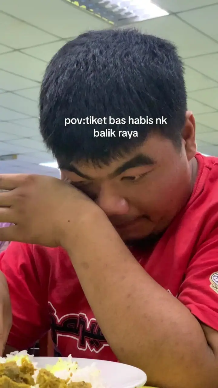 student wiping his tears