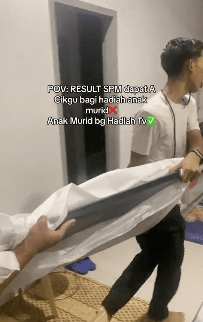 Students carrying in the TV