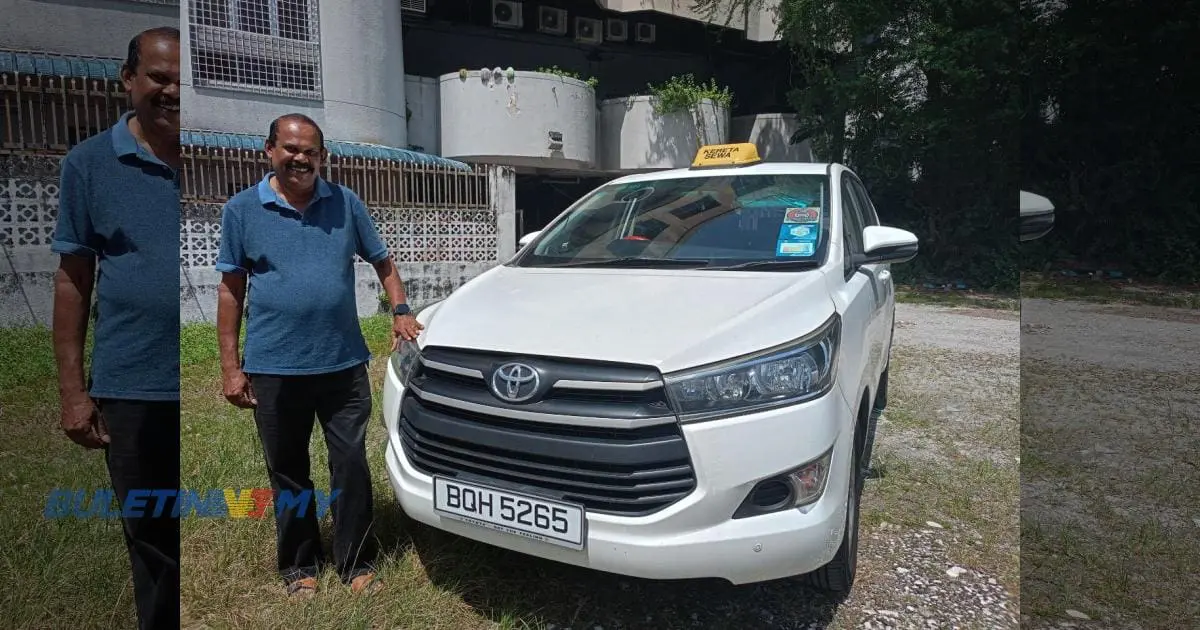 taxi driver standing beside his car