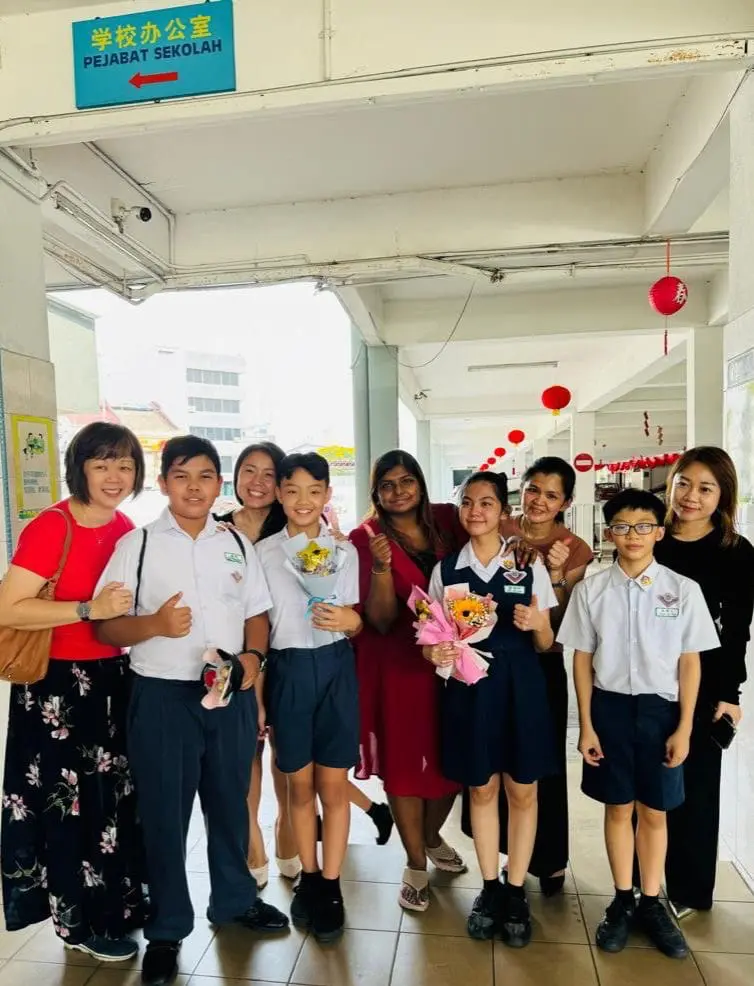 teacher jaslene with colleague and students