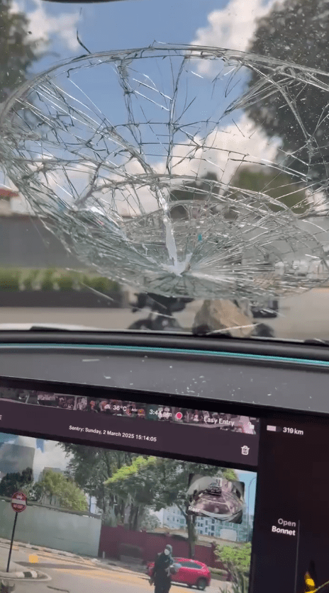 tesla with smashed windscreen