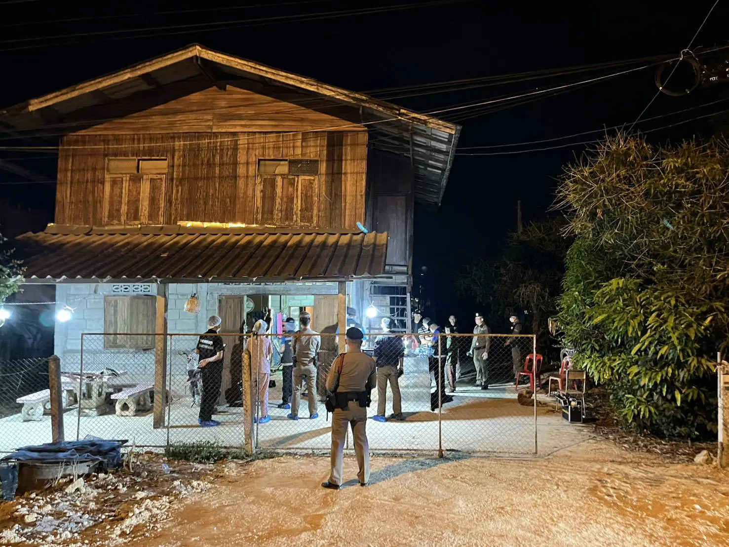 Thai police arrive at house where Phongsakorn was shot