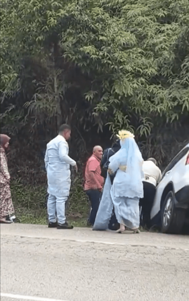The couple lended a hand to help despite still in their weddint costume