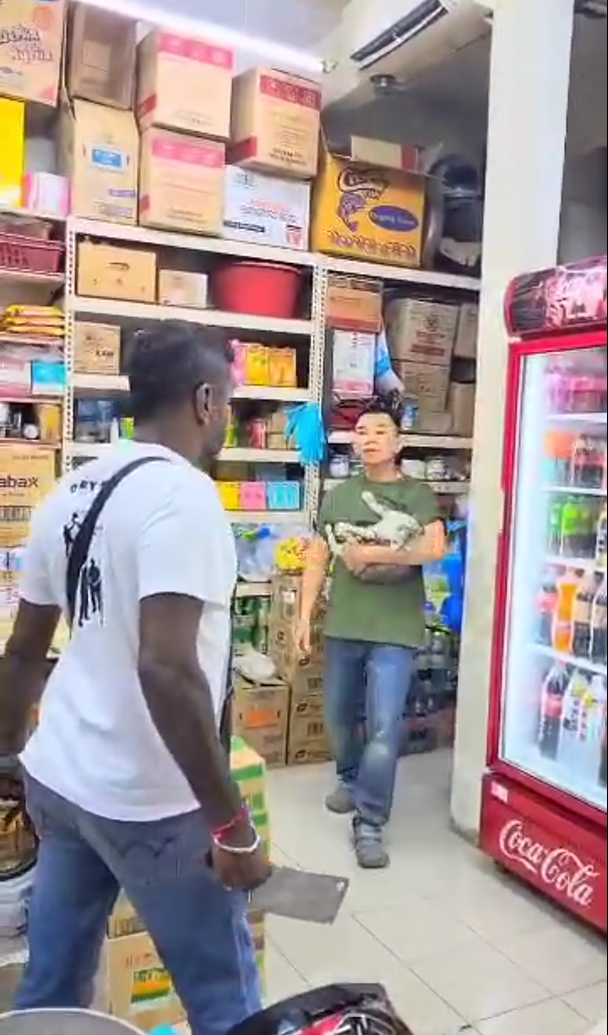 The shop onwer show up with his cat