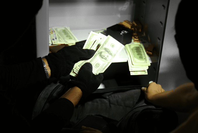 Thief stealing money