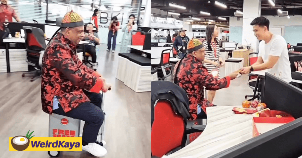 Tony Fernandes Rides Electric Suitcase & Gives Angpaus To Workers While Dressed In Traditional Chinese Outfit