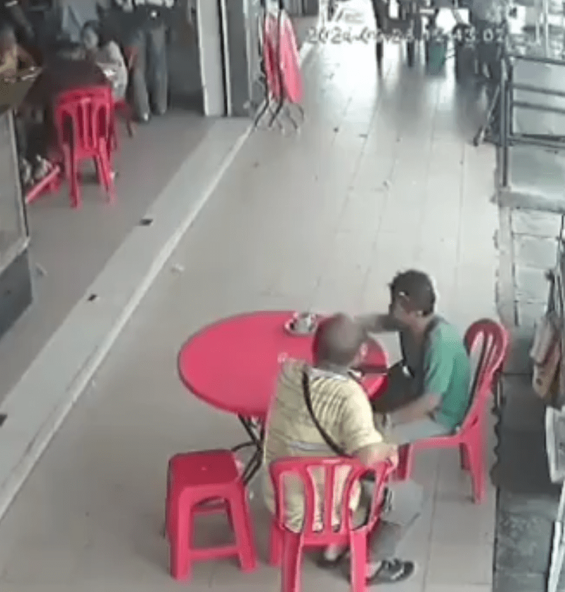 two men having coffee at a kopitiam