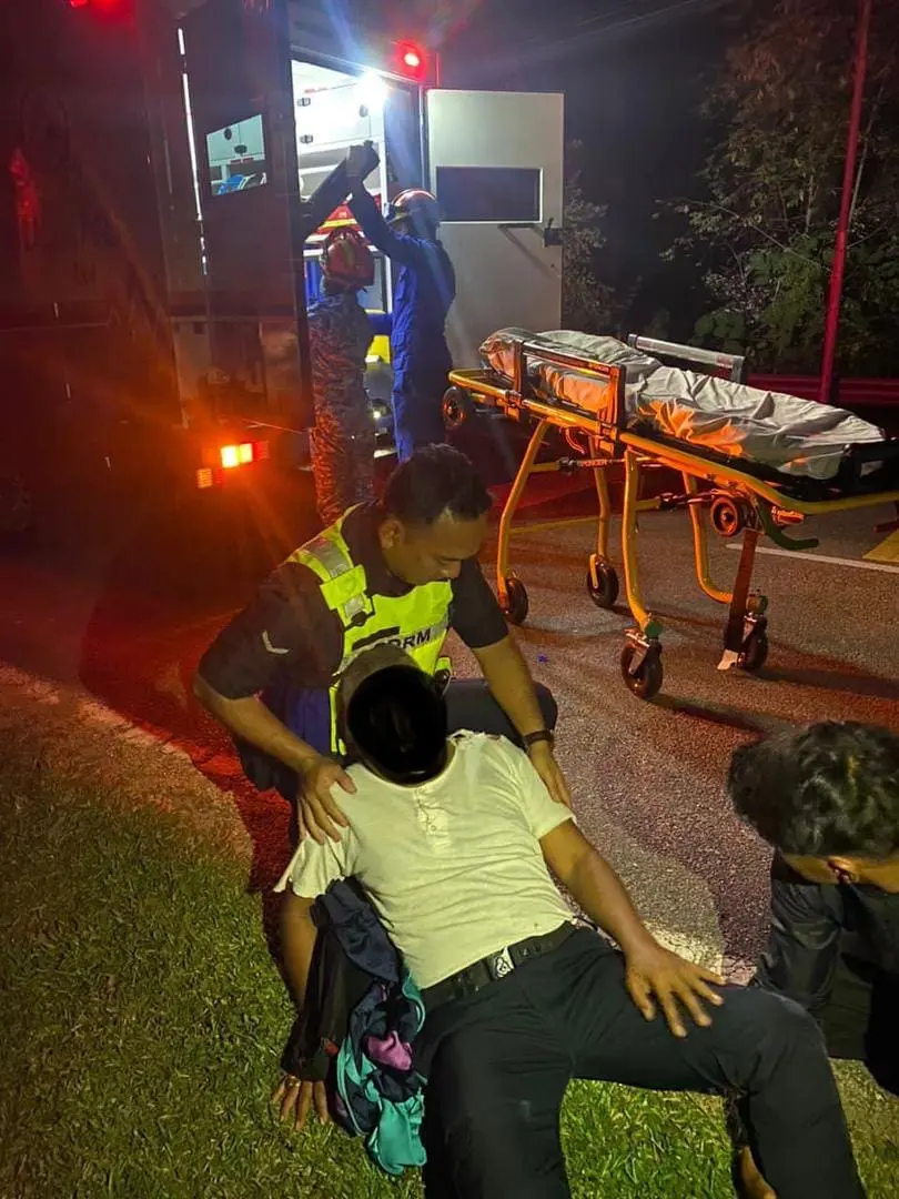 victim being helped by a policeman