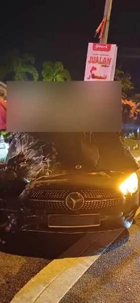 Victim's body on top of Mercedes Benz