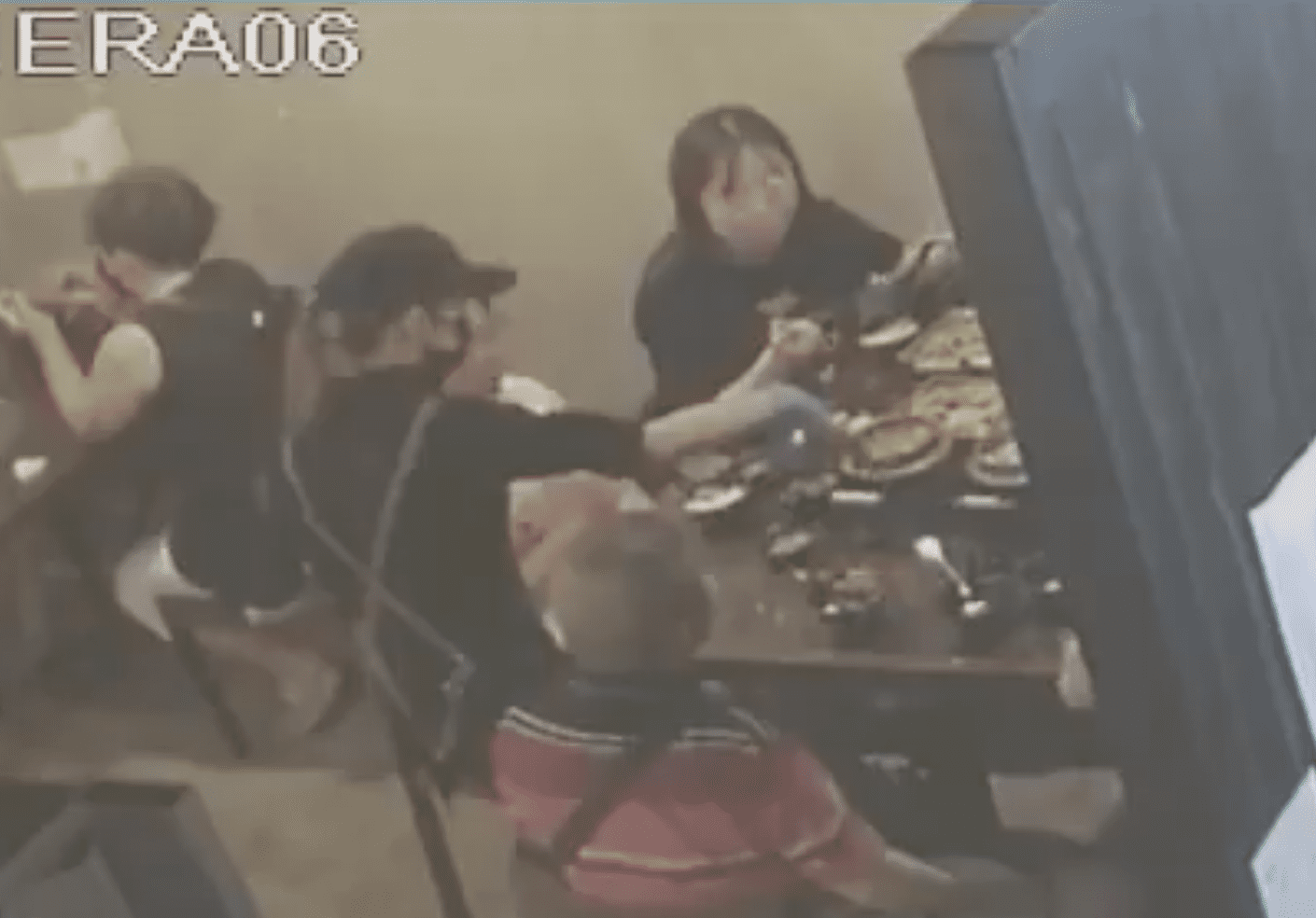 Waiter shaking the gel to rekindle the fire