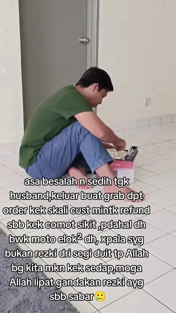 msian man easting the cake alone after been rejected by a customer