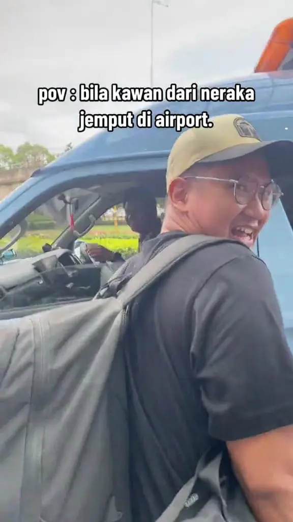 Msian man laughing at his friend