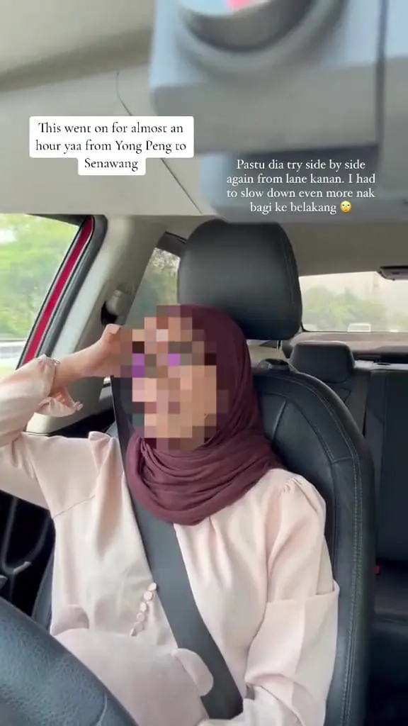 Msian woman in car looking stressed