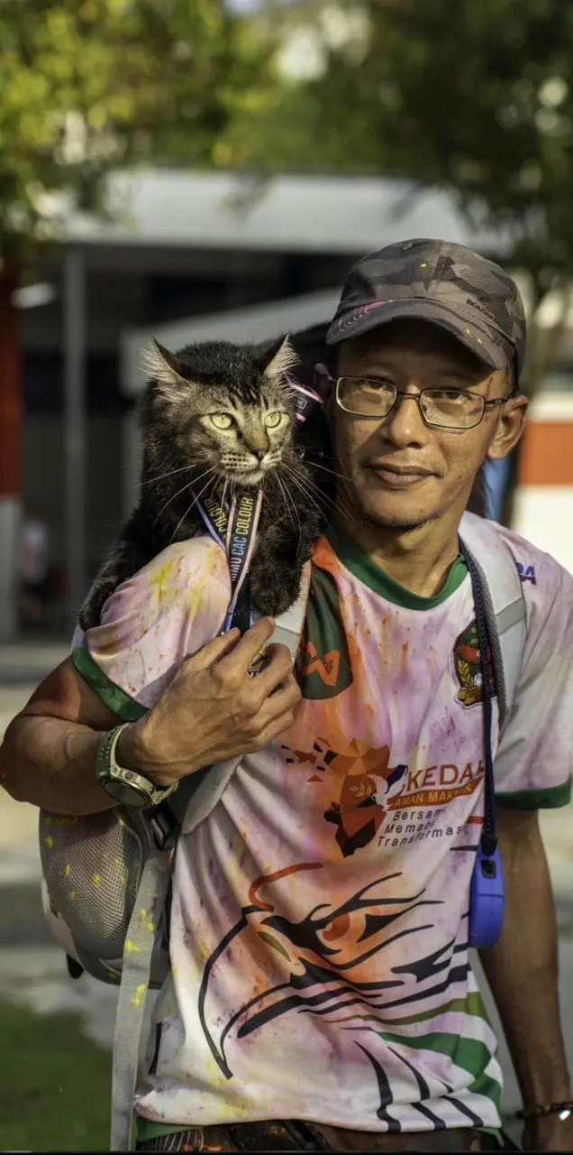 Azhan and his cat Jibek participating another event together
