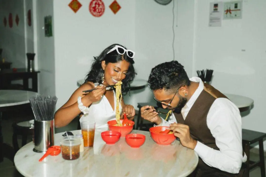 Priscilla and her husband eating Pan Mee at their favorite stall