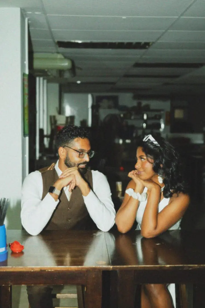 Priscilla and her husband staring each other with love at their favorite Pan Mee stall