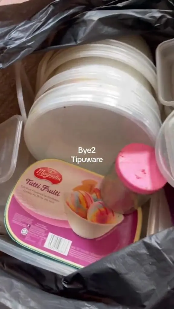 Unused Tupperware thrown in a black plastic bag