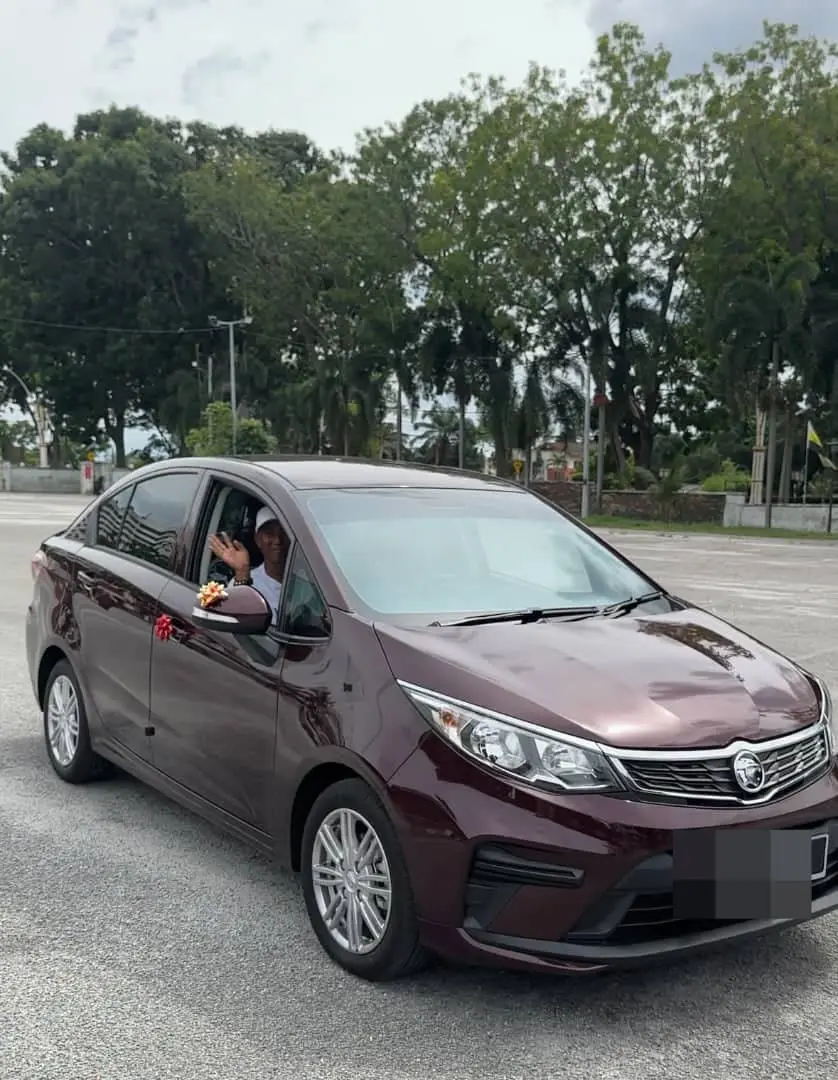 Parents driving their new car. 