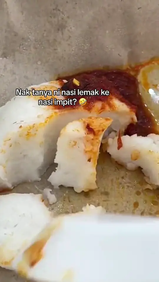 Msian showing her nasi lemak that looks like nasi impit. 