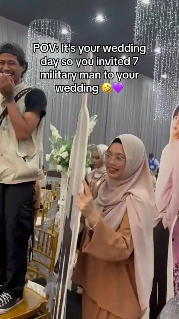 Photograhoer is giggling seeing the Msian couple's friends bringing in BTS standees to the stage.