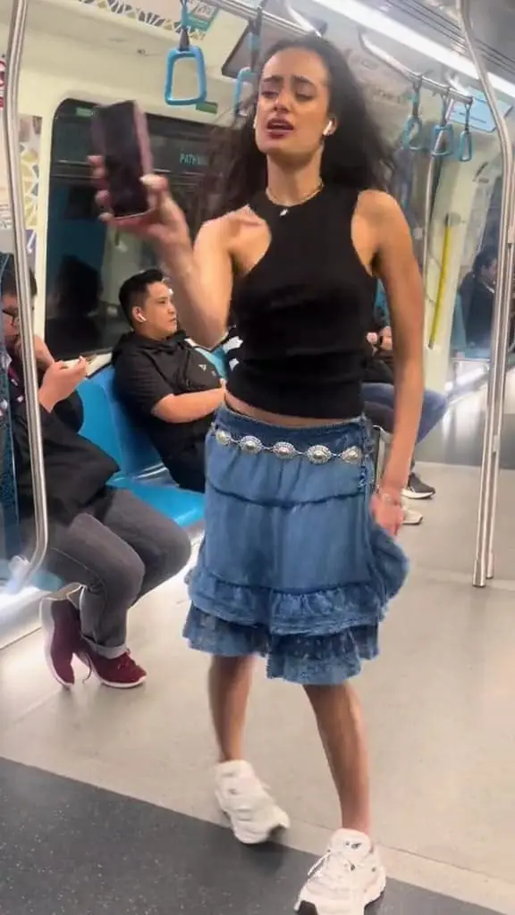 Sabrina Bahsoon filming her viral trend vidoe on mrt.
