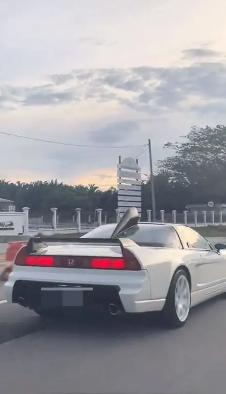 Msian couple shocked by rare car that looks like Ultraman on Muar road.