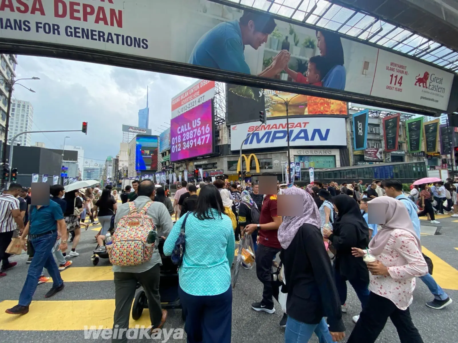people crossing roads at bukit bintang