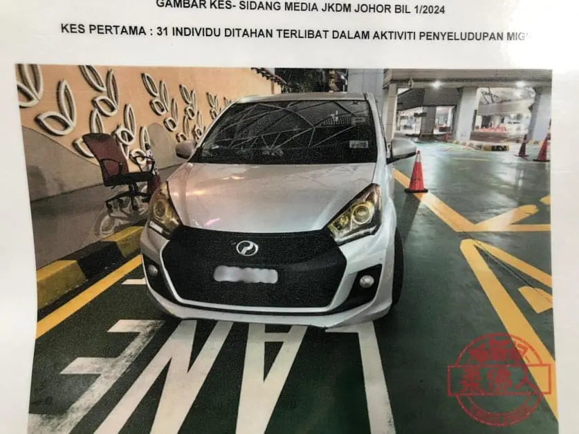 White Myvi which tried smuggling SG man into M'sia