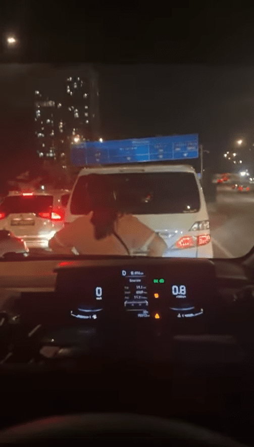 Woman blocks car with her body at JB checkpoint