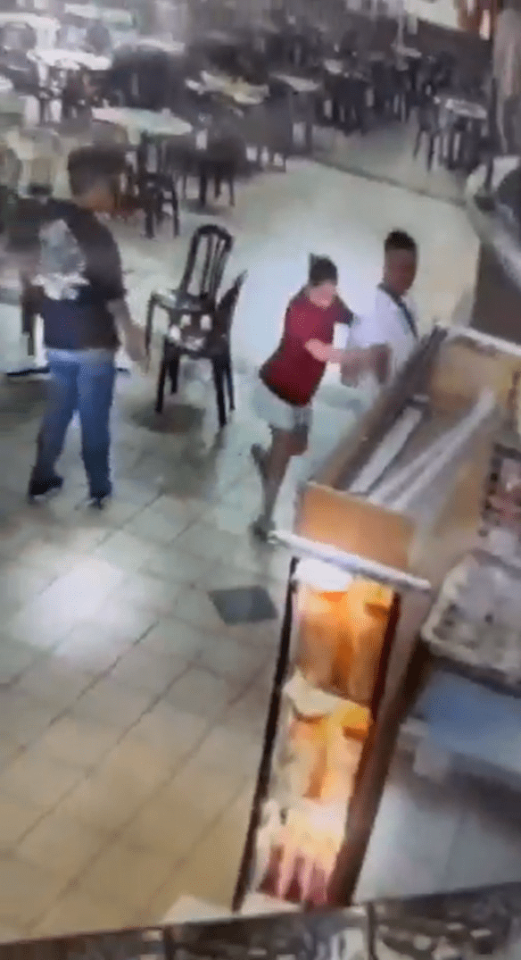 Woman drags man away from Puchong food court