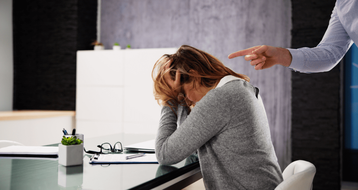 Woman getting scolded by boss