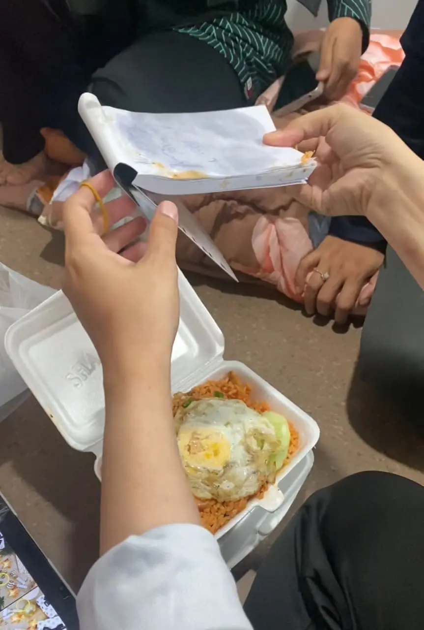 woman holding a notepad