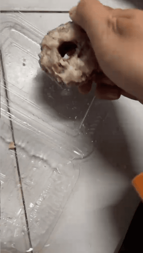 woman holding kuih keria