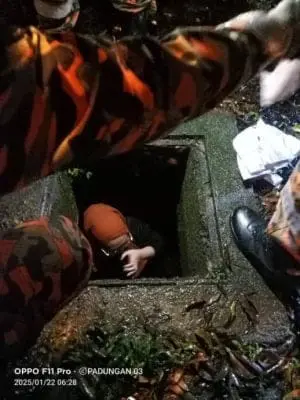 Woman inside drain in Kuching