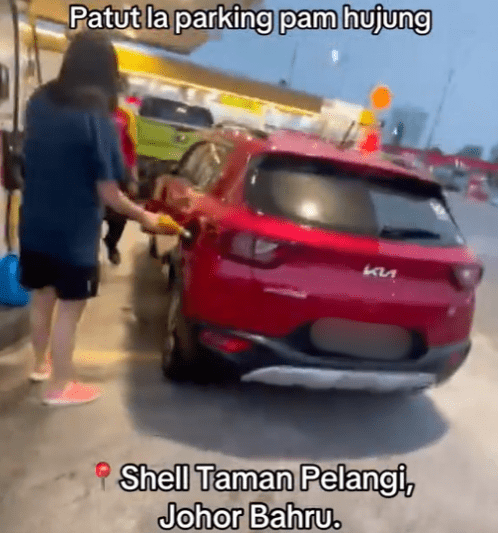 Woman pumps RON95 into SG-registered car
