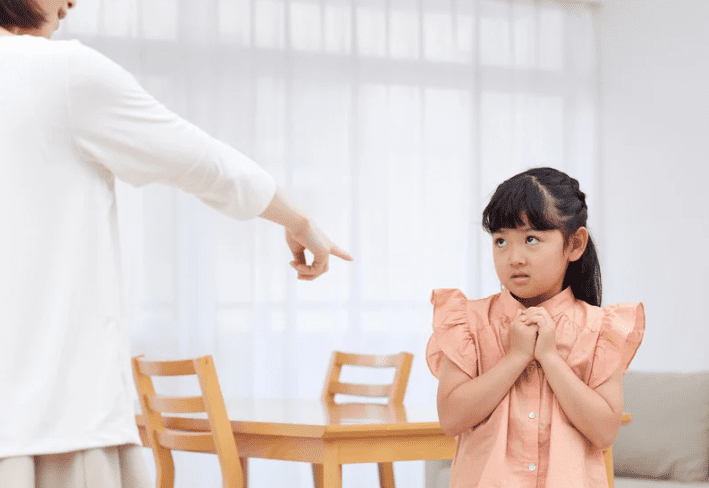 Woman scolding her kid