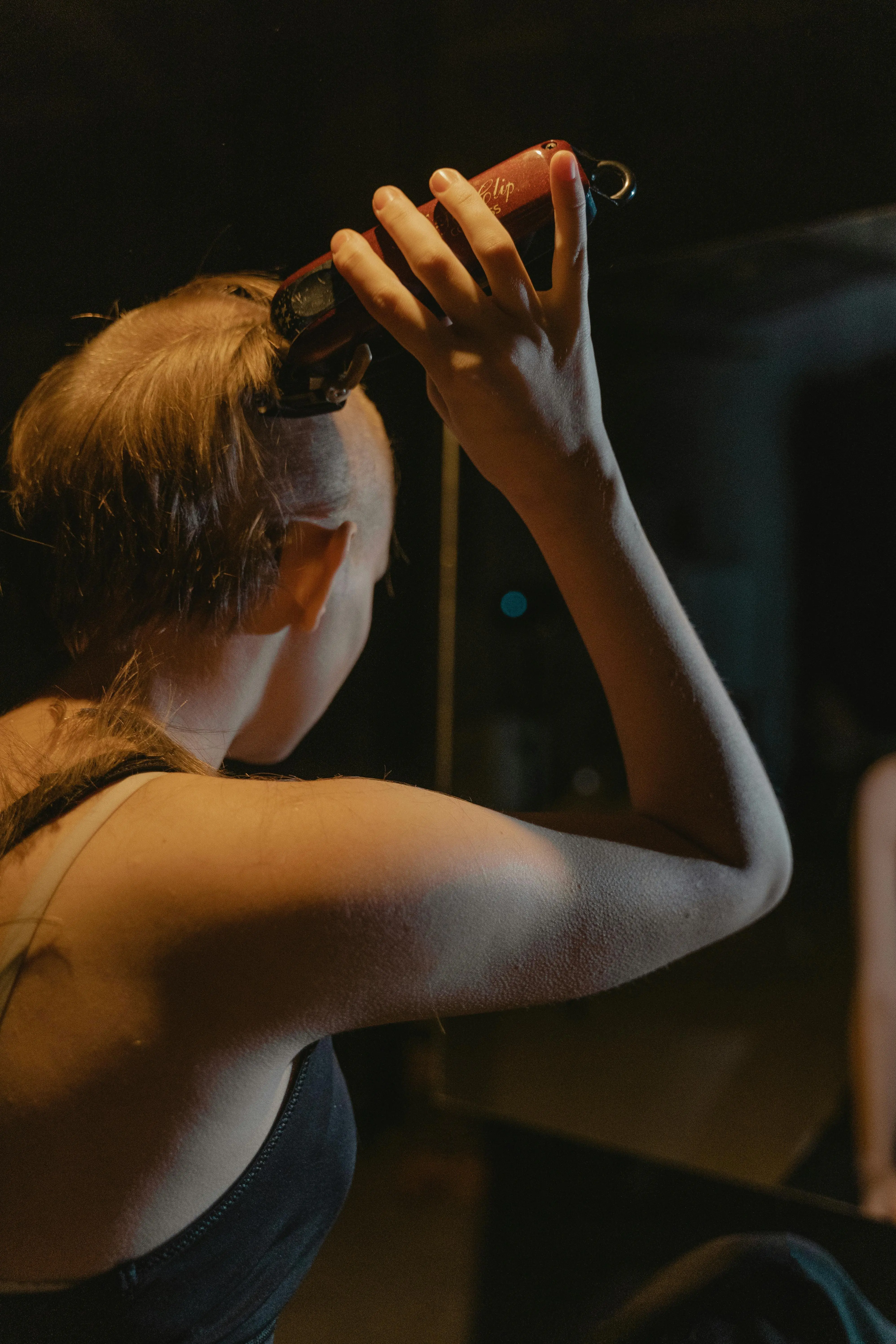Woman shaving her head