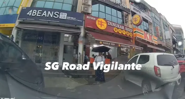 Woman stands inside parking lot in Johor