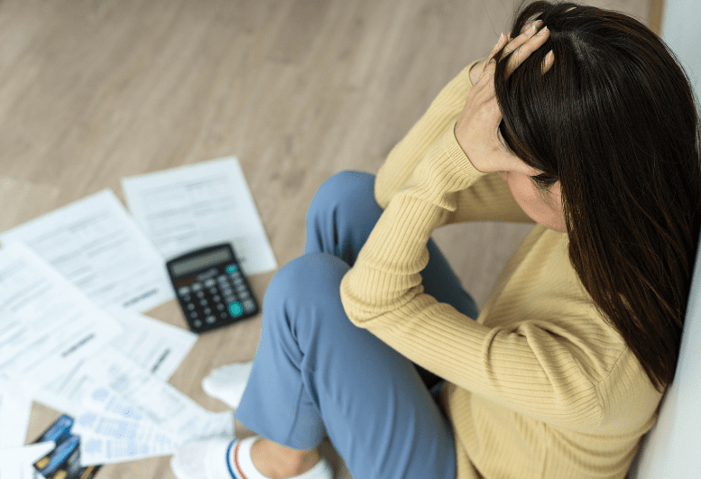 woman stress after looking at the bills