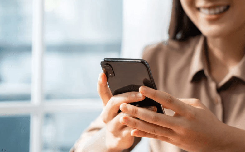 Woman using handphone