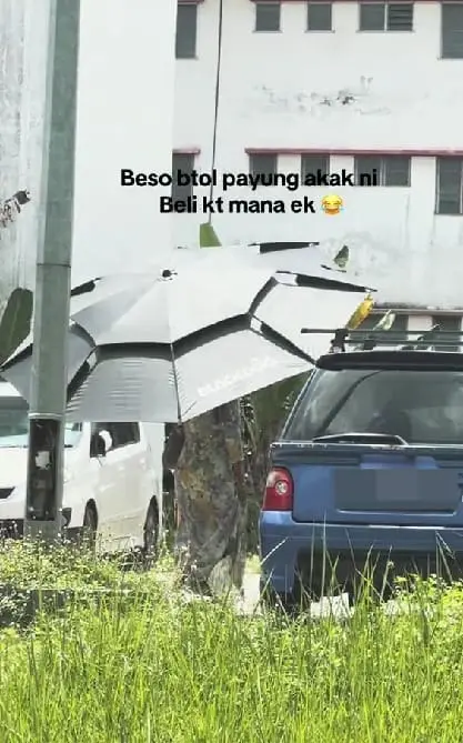 woman walking with camping umbrella