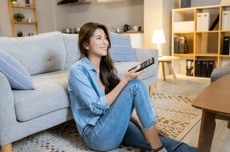 Woman watching TV in the living room
